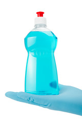 hand in glove holding bottle of blue dish washing liquid isolate