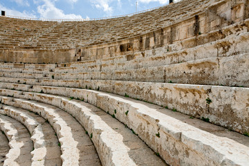 stone seats in antique Large South Theatre , Jerash