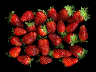 Sweet ripe strawberry on a black background