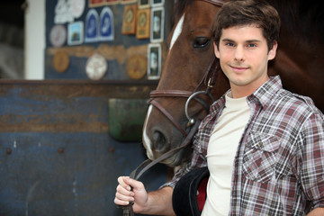 Fototapeta na wymiar Young man with horse