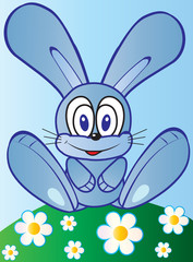 Cute little bunny on the spring meadow