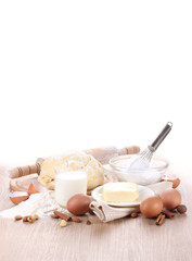 Ingredients for the dough wooden table on white background