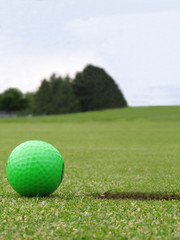 green golf ball on green
