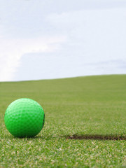 green golf ball on green