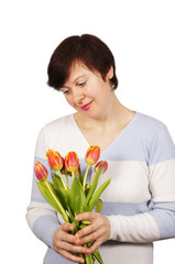 Woman holds a bouquet of tulips