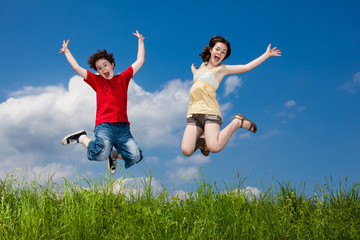 Girl and boy running, jumping outdoor