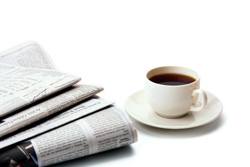 Coffee cup and newspaper
