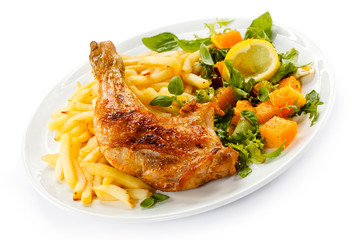Grilled chicken leg, chips and vegetables
