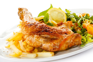 Grilled chicken leg, chips and vegetables