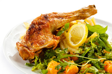 Grilled chicken leg, chips and vegetables