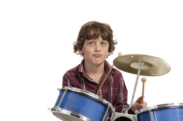 Fototapeta na wymiar young boy playing drums