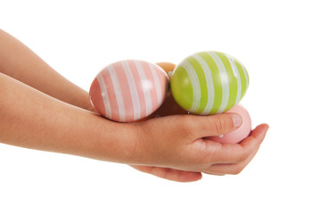 Obraz premium Child hands with easter eggs