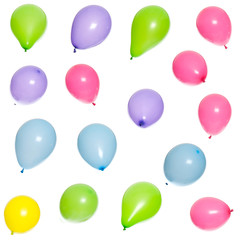 Sixteen multicolored balloons floating