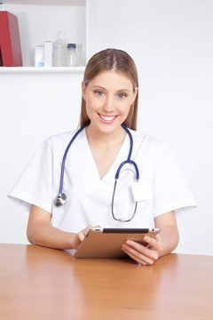 Medical Professional Using Digital Tablet