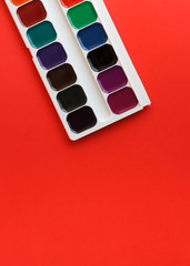 brushes on red texture art palette