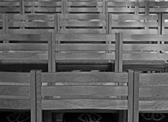 Rows of chairs inside Cathedral, monochrome