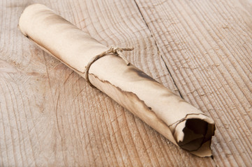 an old scroll on an old wooden background