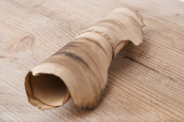 an old scroll on an old wooden background