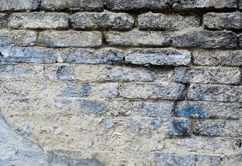 vintage damaged straw brick wall background