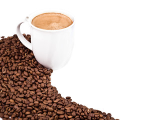 a cup of coffee and roasted coffee beans