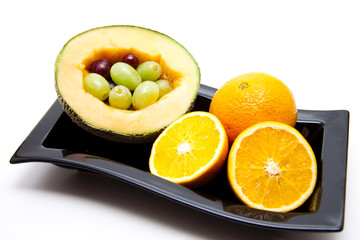 Melone mit Trauben und Orangen