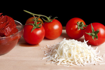 Tomato paste, cheese and some tomatoes
