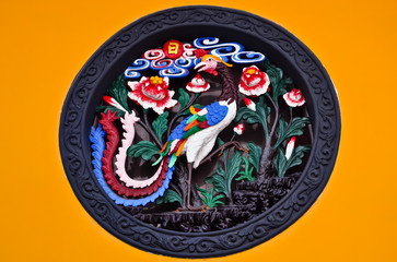 colorful chinese ornament of a peacock