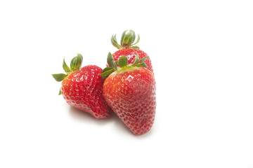 Three strawberries on white background