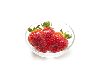 Three strawberries on white background