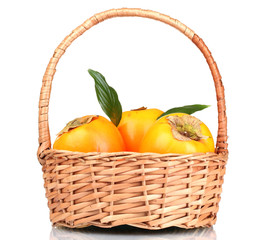 Appetizing persimmons with leaves in pad isolated on white