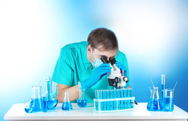 scientist in the lab working with microscope