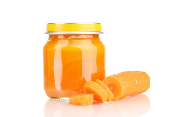 Jar of baby puree with carrot isolated on white