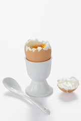 A boiled egg in cup with spoon, Isolated with Clipping Path