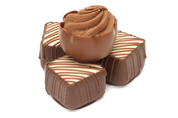 Chocolate pralines on white background