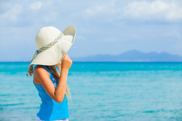 Girl in big hat relax ocean background