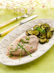 escalope with white wine sauce and sauteed zucchinis