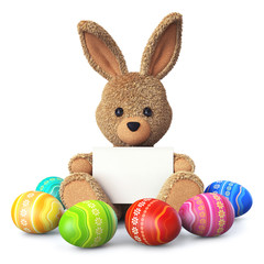 Stuffed bunny with colorful easter eggs and greeting card