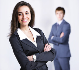 Attractive businesswoman with her arms crossed.