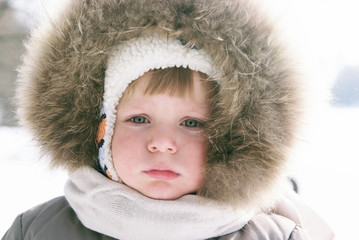 Cute boy in winter clothes