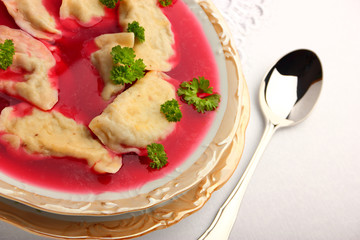 Delicious dumplings with champignon mushrooms stuffing in borsch