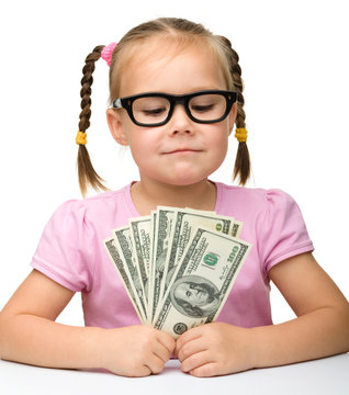 Cute Cheerful Little Girl With Paper Money