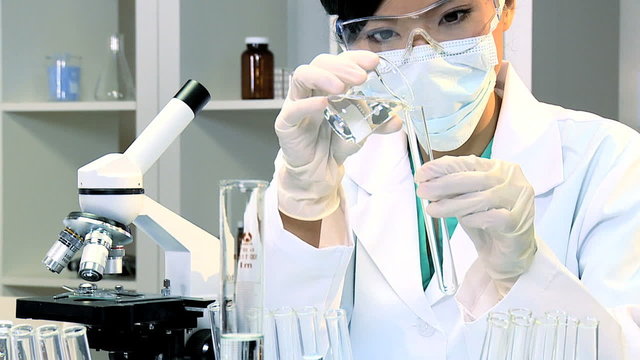 Female Student Doing Experimental Medical Research