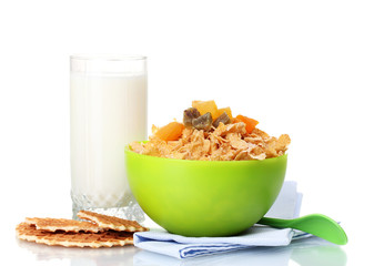 tasty cornflakes in green bowl and glass of milk isolated