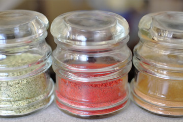 cans with colorful spices
