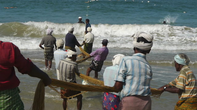 Fishermen pulling a trawl