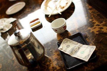 Cash tip on table at a Chinese restaurant.