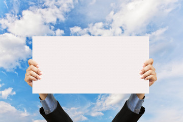 businessman holding blank sign and hand in sky