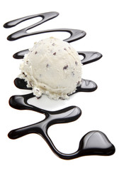 Stracciatella ice cream scoop with chocolate sauce
