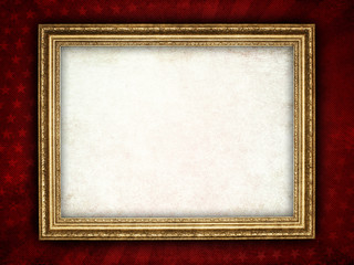 Old frame on red grunge background