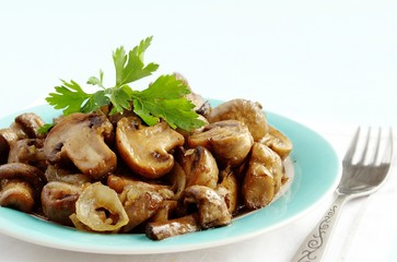 mushrooms in a bowl, decorated with greenery